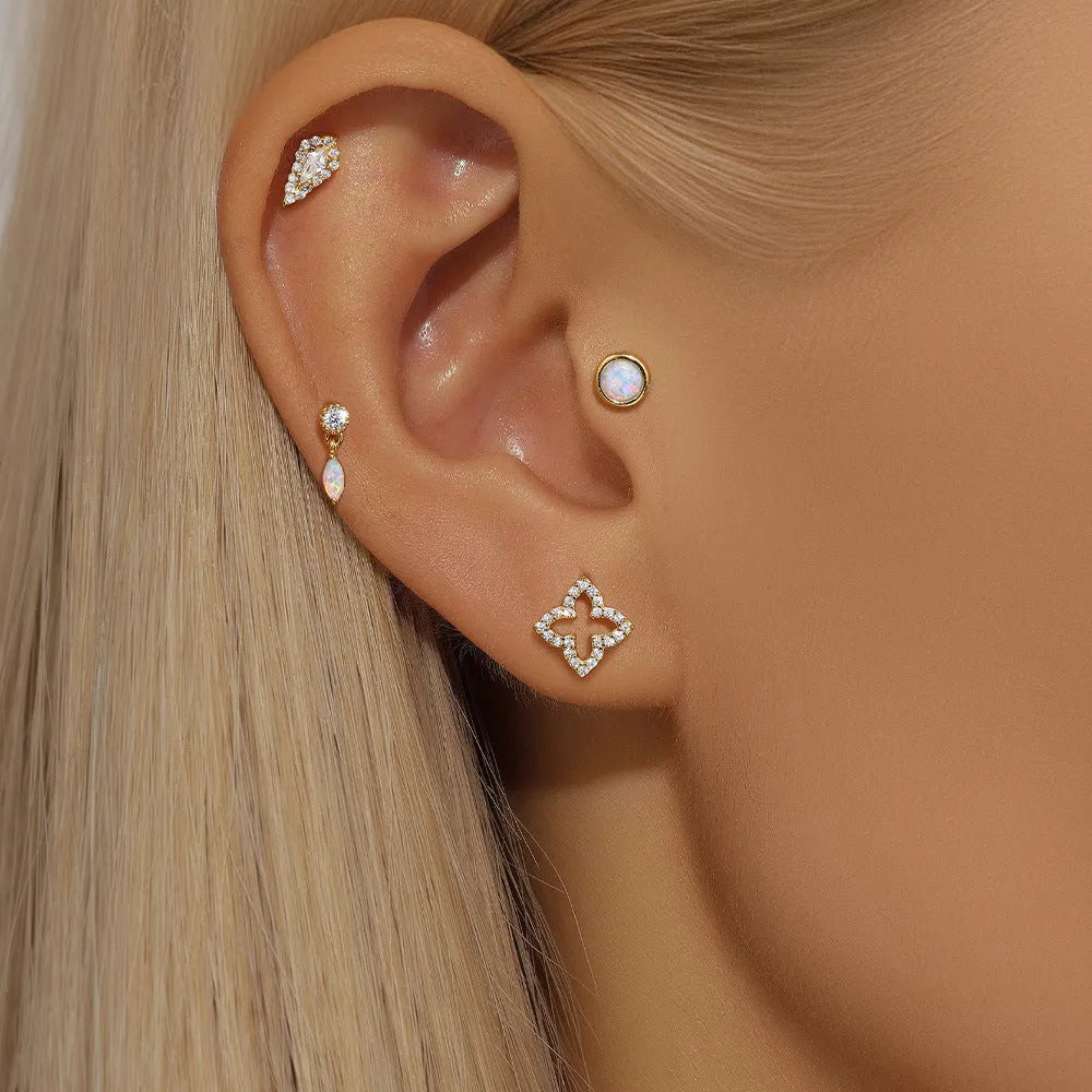 A pair of minimalist S925 sterling silver ear bone studs with a flat column thread post in a gold tone colour.