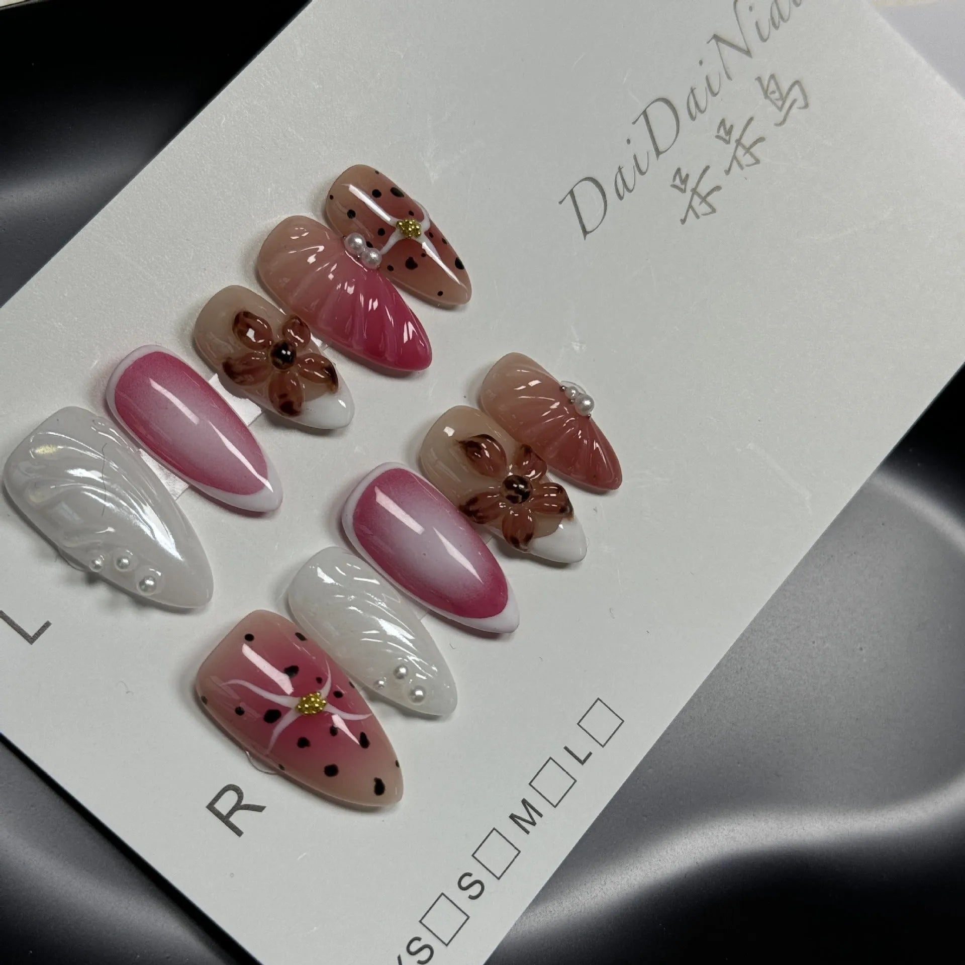 Hand-painted three-dimensional carved plastic nail patches with embossed candy patterns in almond shape