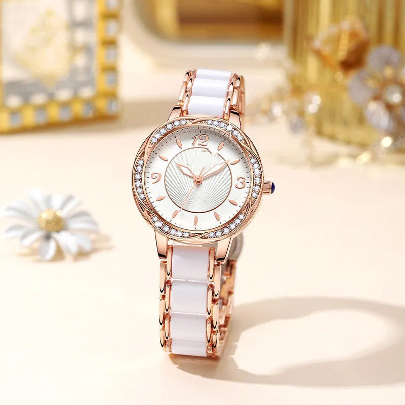Women's quartz watch with ceramic-style steel strap, alloy case, and 31.1mm white dial in rose gold