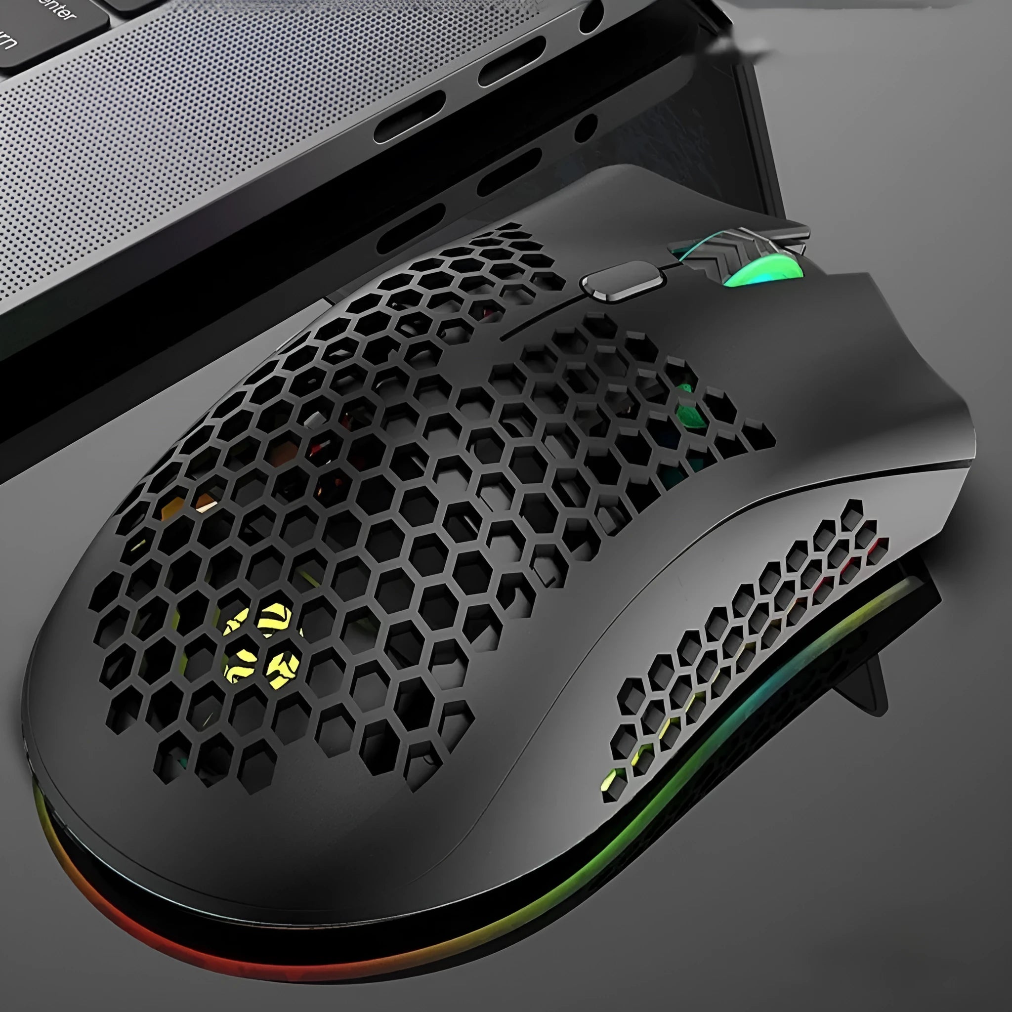 BM600 wireless gaming mouse with luminous hollow-out shell in cyan colour.