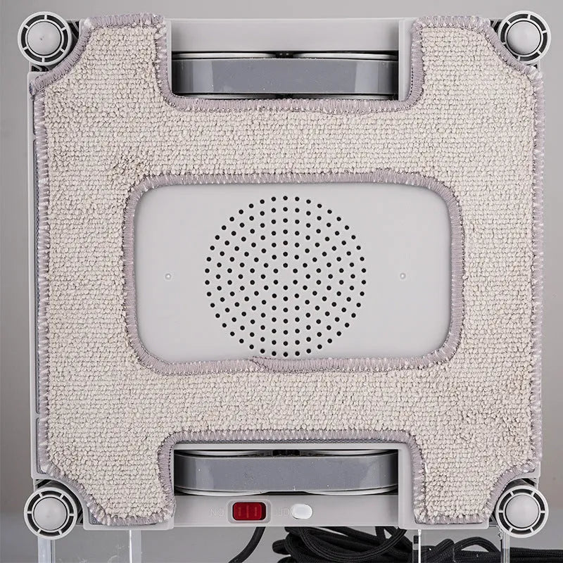 White intelligent window cleaning robot with a square 220mm body on a glass window pane.