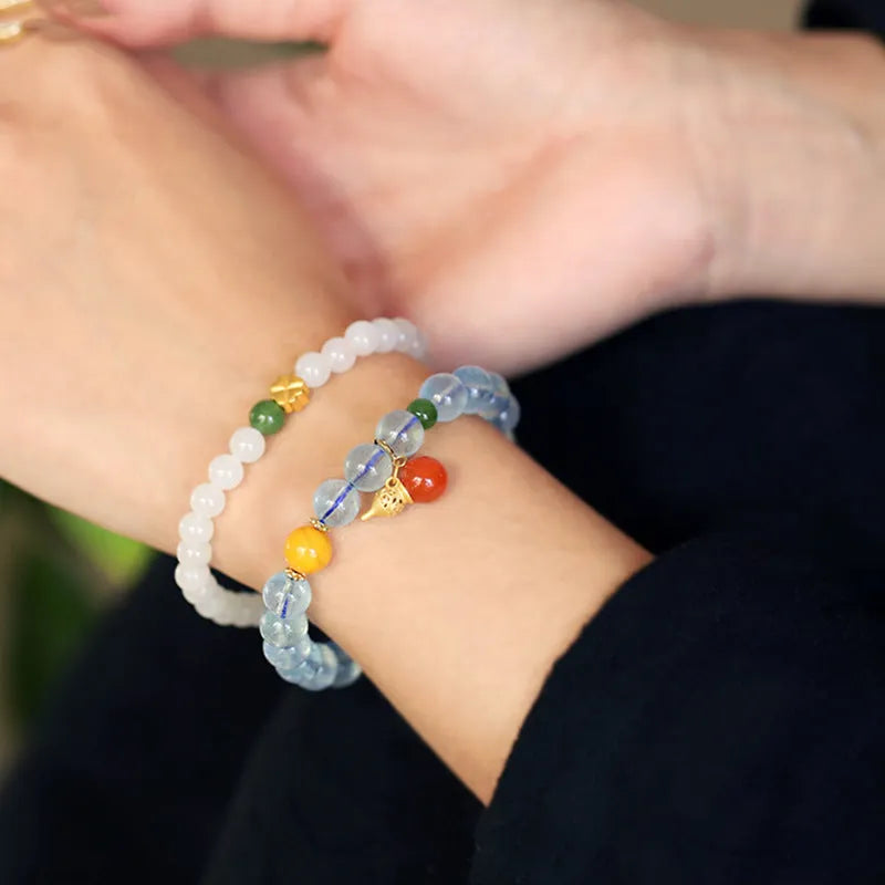 Women's geometric bracelet with blue 8mm aquamarine beads and ethnic retro design.