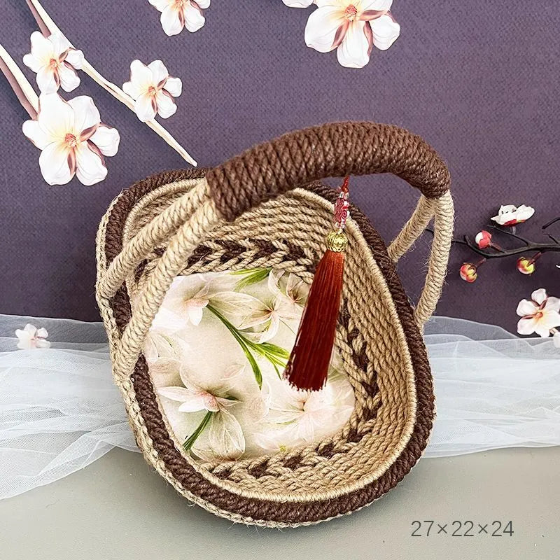 Hand-woven straw basket with hemp rope detail in coffee brown colour.