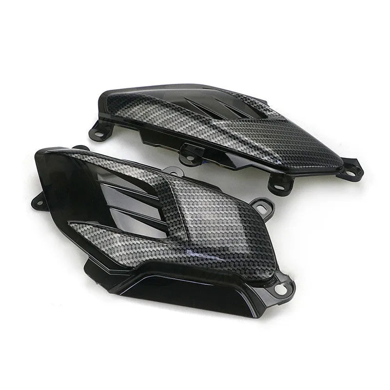 Pair of aftermarket side lamps for Yamaha NMAX motorbike with carbon fibre design and LED light.