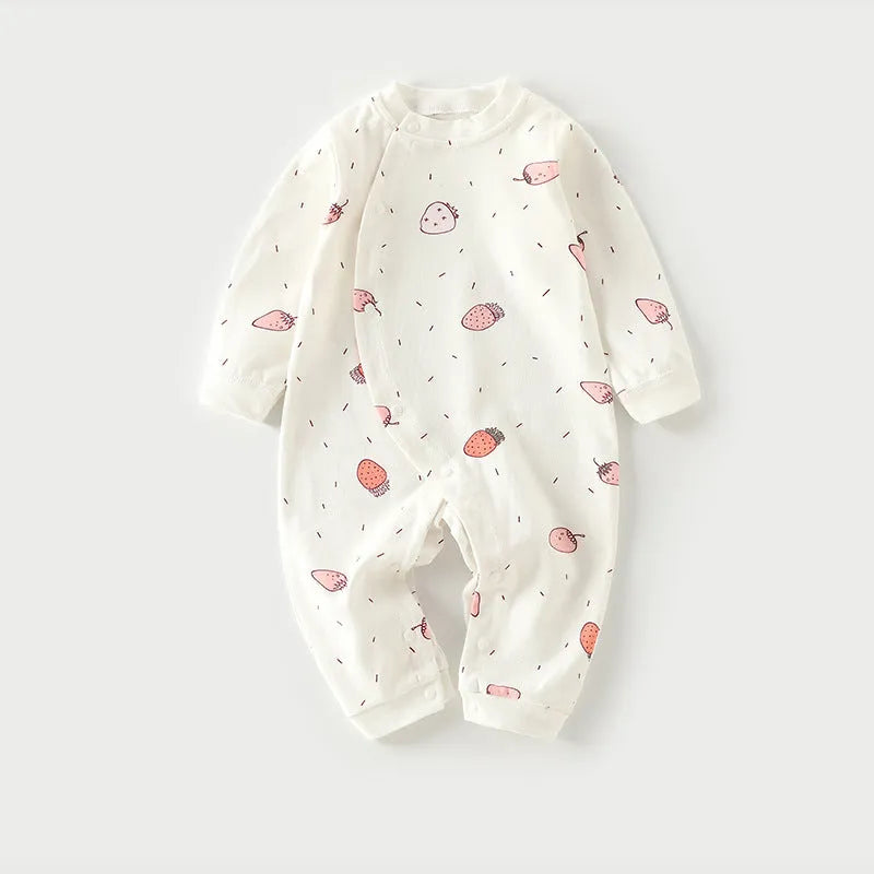 Cotton baby pajamas in cartoon dragon print for a newborn infant.