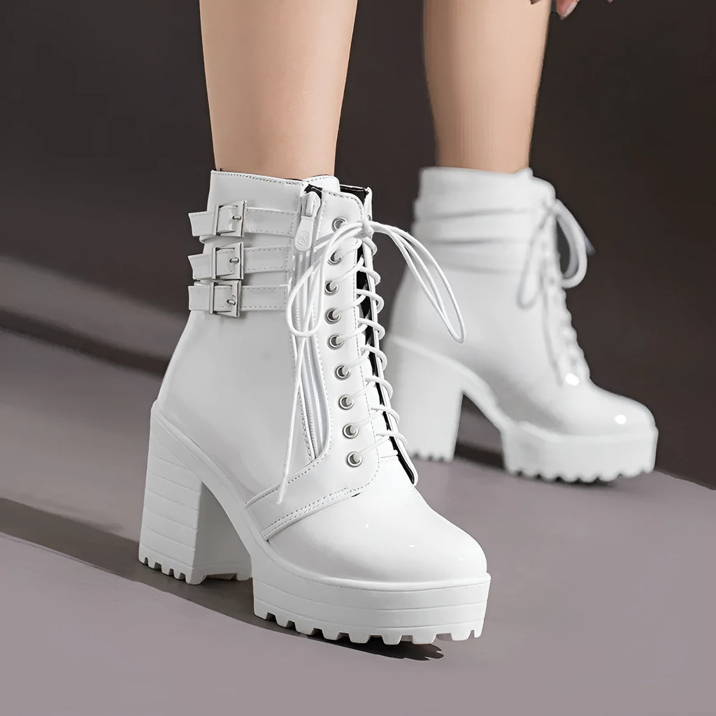 Women's black thick-heeled ankle boots with a lace-up front and waterproof platform on a rubber sole.