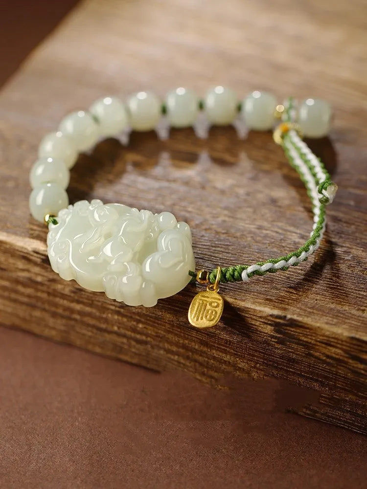 Hetian jade and S925 silver Chinese zodiac bracelet on a red rope for the Year of the Rabbit