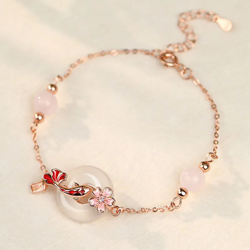 Sterling silver bracelet with white chalcedony crystals and electroplated koi pattern design