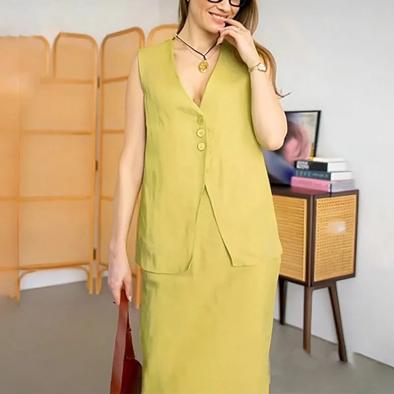 Women's blue casual two-piece suit with sleeveless vest and long skirt on a hanger.