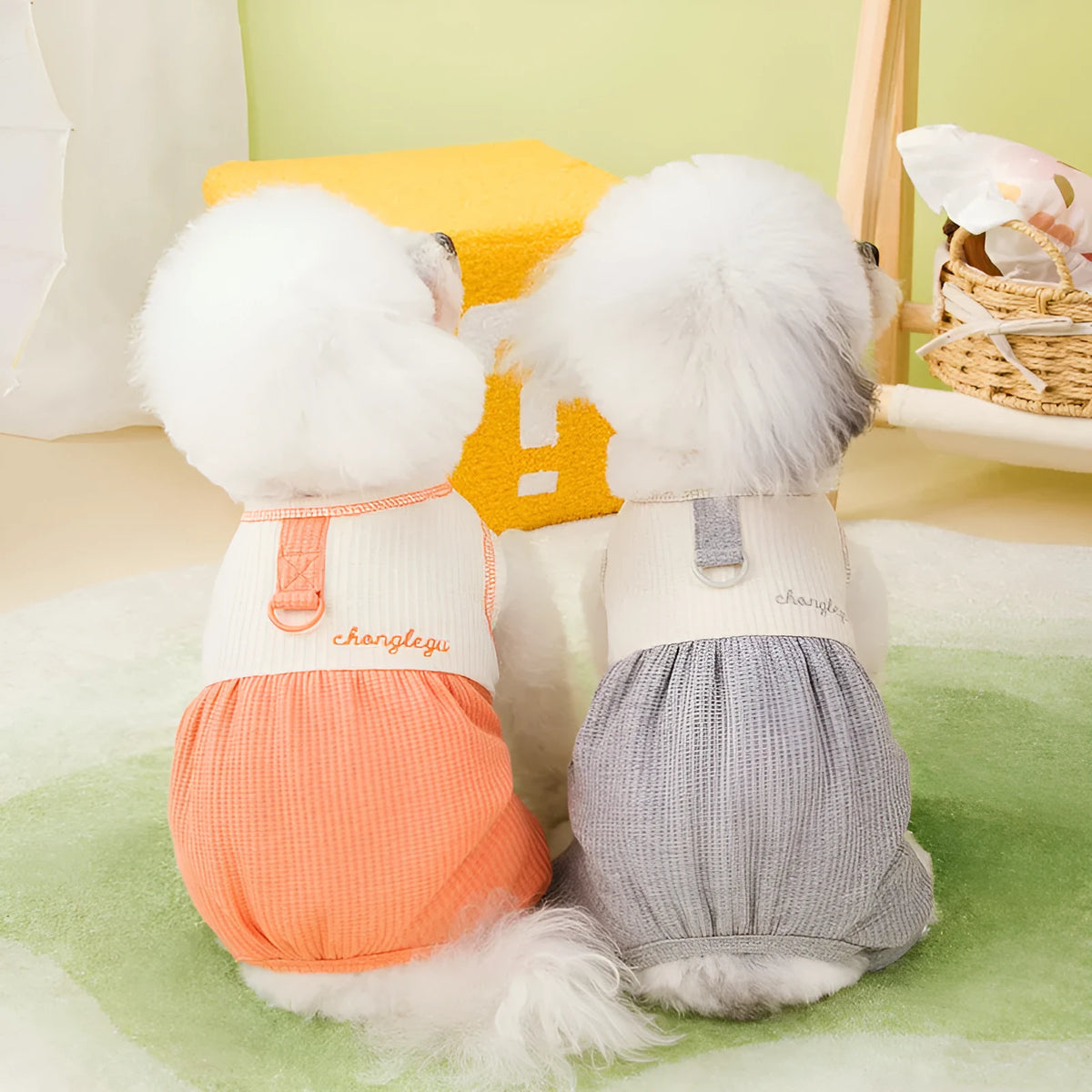 Set of three fashion personalised puppy pyjamas in orange, gray, and purple polyester fabric on white background