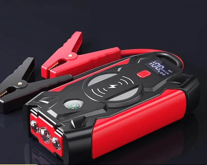 Red 12V car battery jump starter power pack with digital display and heavy-duty crocodile clips