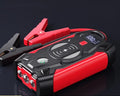 Red 12V car battery jump starter power pack with digital display and heavy-duty crocodile clips