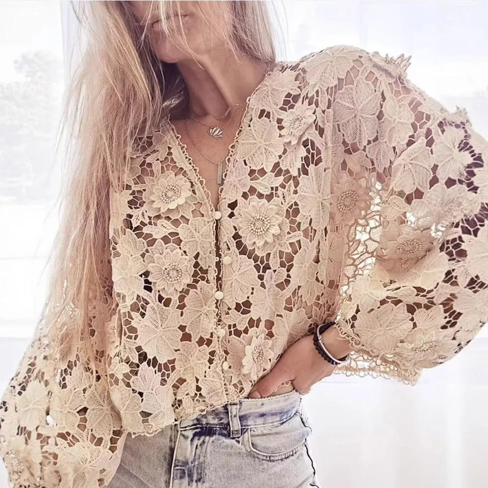 Loose fit lace cardigan with V-neck, long sleeves, and a 3D hollow flower decoration in black colour.