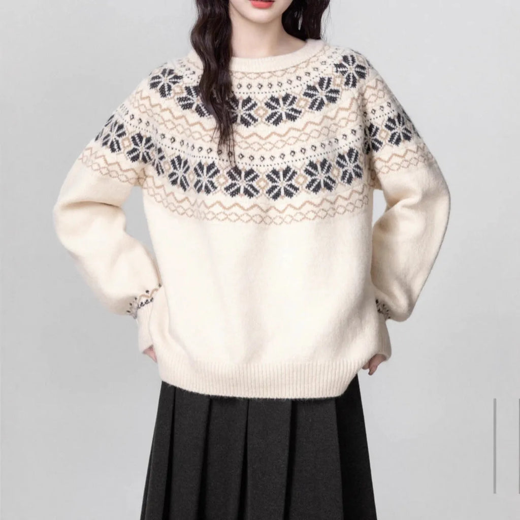 Women's loose-fit Milky White Fair Isle knitted pullover sweater on a hanger, showing geometric pattern and thick lambswool blend fabric.