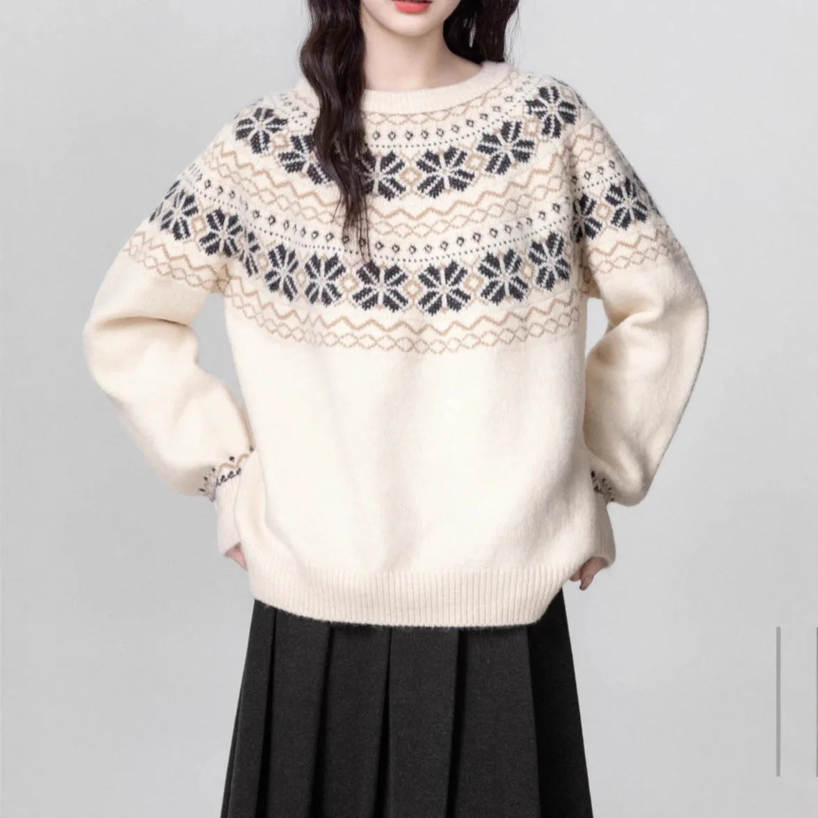 Women's loose-fit Milky White Fair Isle knitted pullover sweater on a hanger, showing geometric pattern and thick lambswool blend fabric.