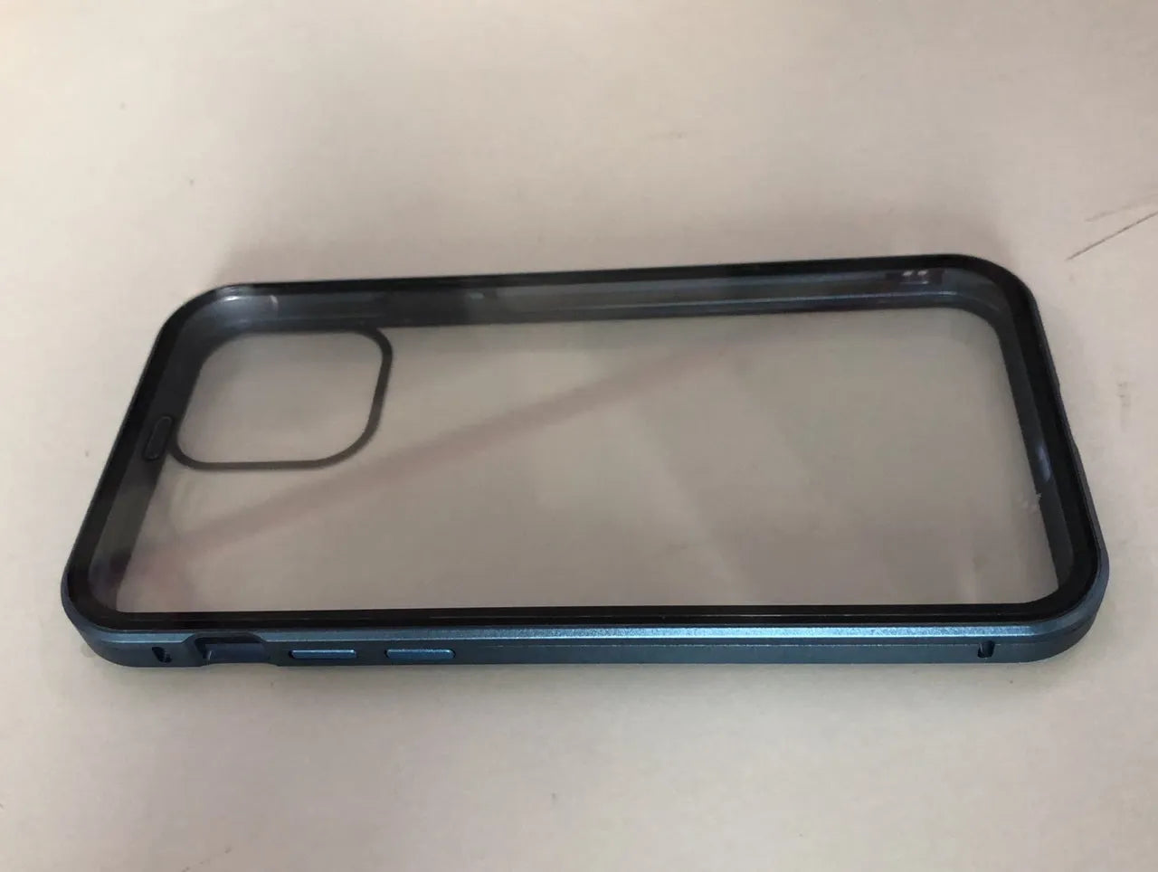Machined glass clamshell anti-spy phone case in black, shown closed and open next to an iPhone.