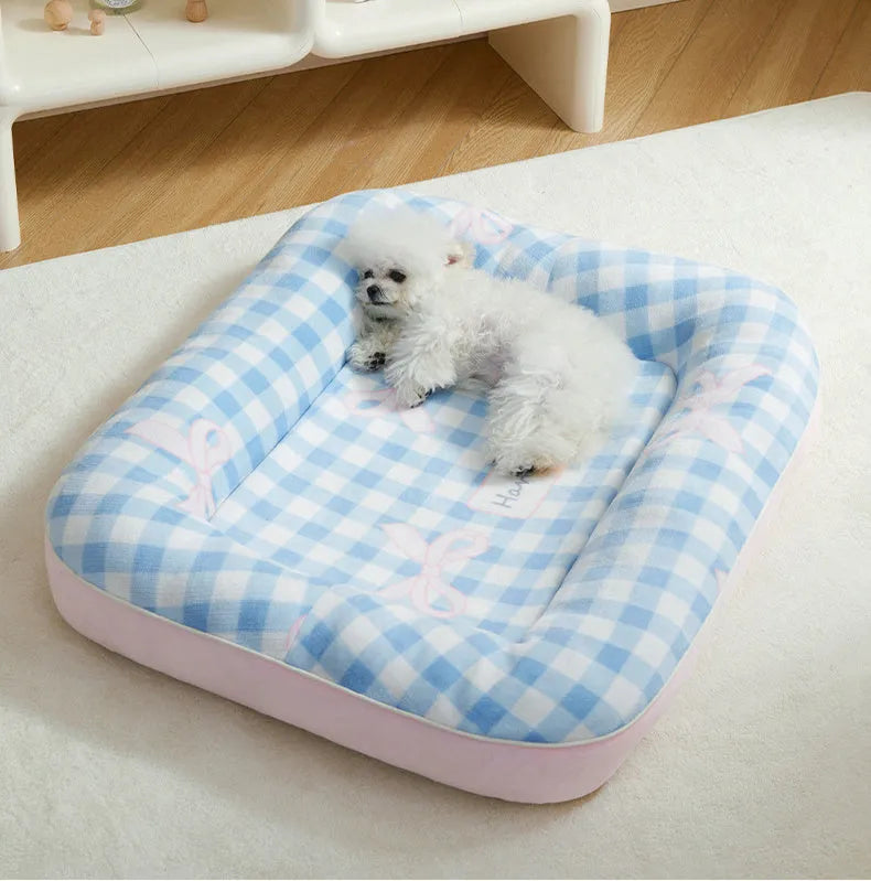 Blue small dog bed cushion with PP cotton fill, size M, on a sofa