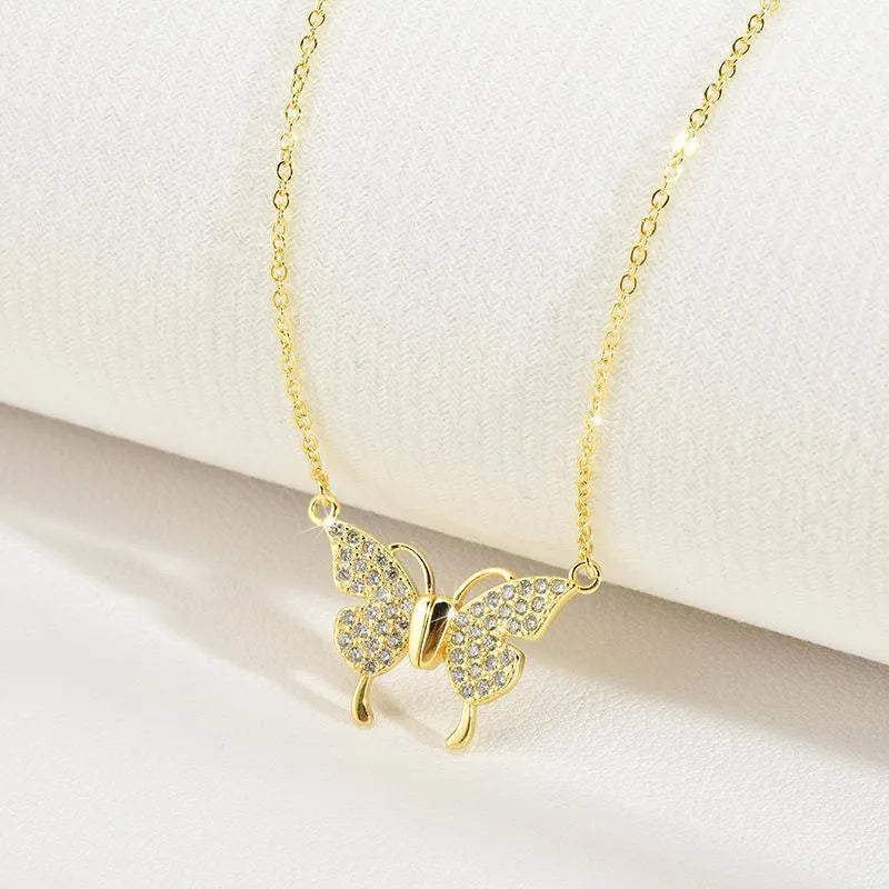 Women's magnetic snap butterfly necklace with twisted chain in gold or silver colour