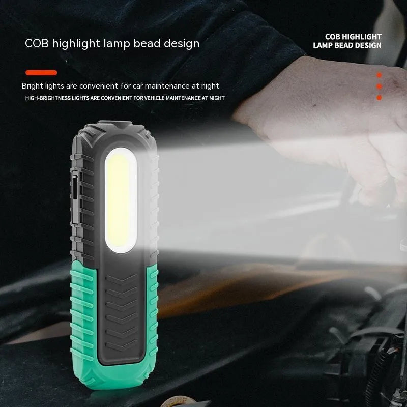 Black and green USB rechargeable auto inspection work light with drop-resistant coating.