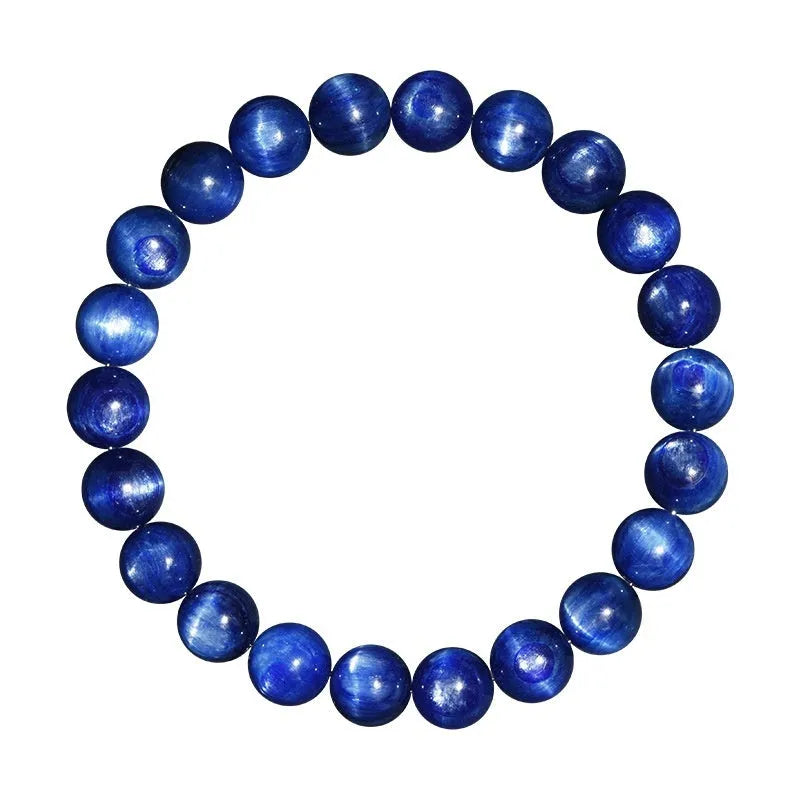 Polished blue geometric crystal bracelet with Ruyi design elements on a wrist.