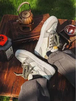 Green low-top casual shoes with a white star stitching pattern and white rubber sole.