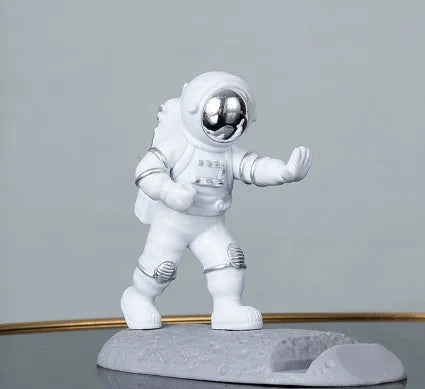 Astronaut decoration spaceman plastic mobile phone holder in blue, gold, and silver colours for lazy binge-watching