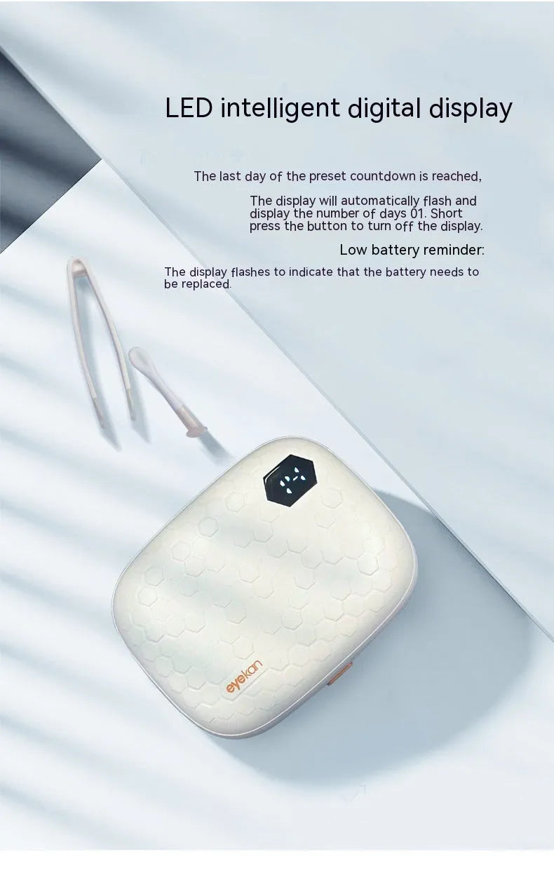 Pearl white automatic ultrasonic flushing instrument for cleaning glasses on a table.