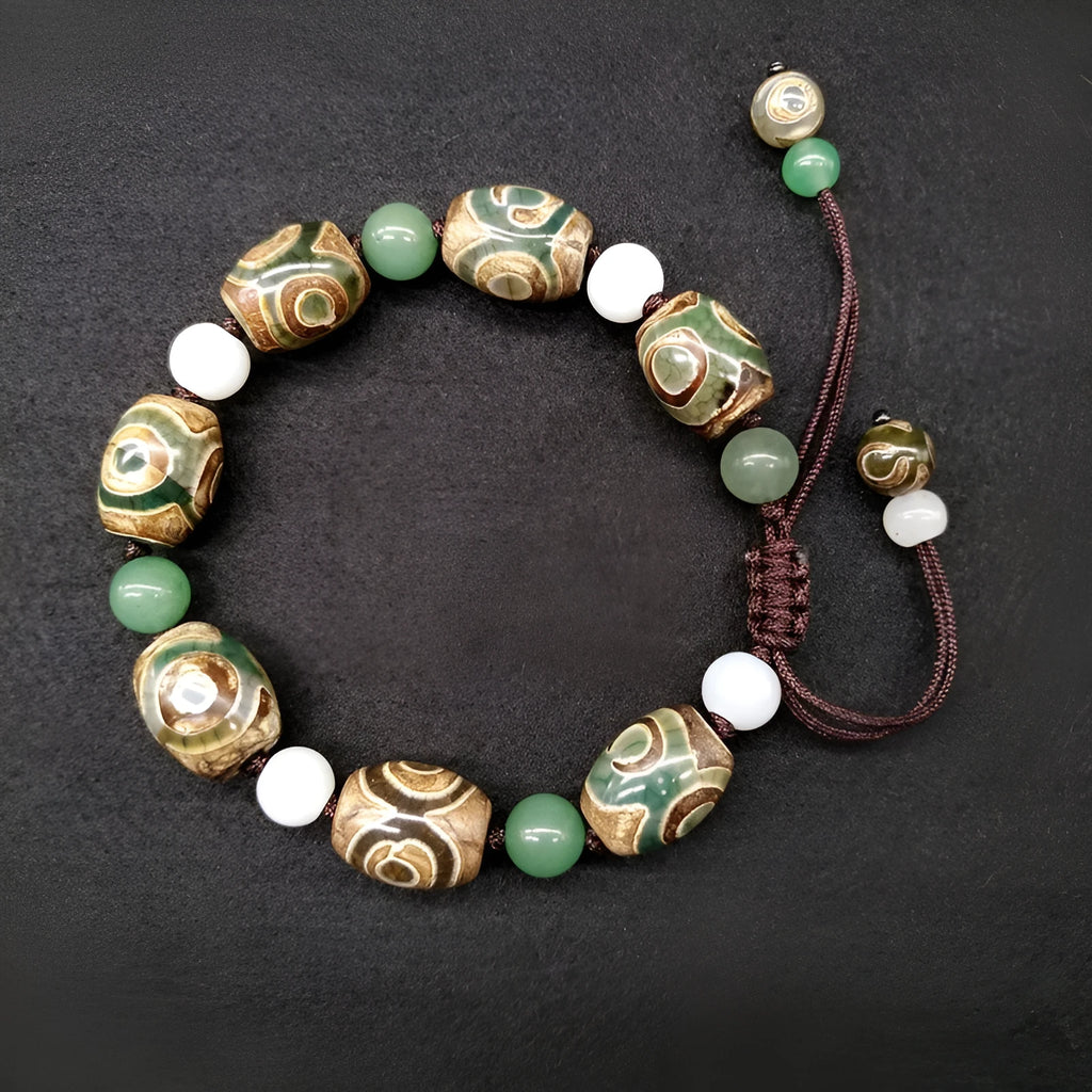 Green agate Tibetan bracelet with hand-woven three-eye geometric pattern