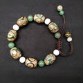 Green agate Tibetan bracelet with hand-woven three-eye geometric pattern