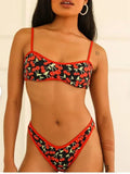 Women's cherry print floral bikini swimsuit with tube top and briefs.