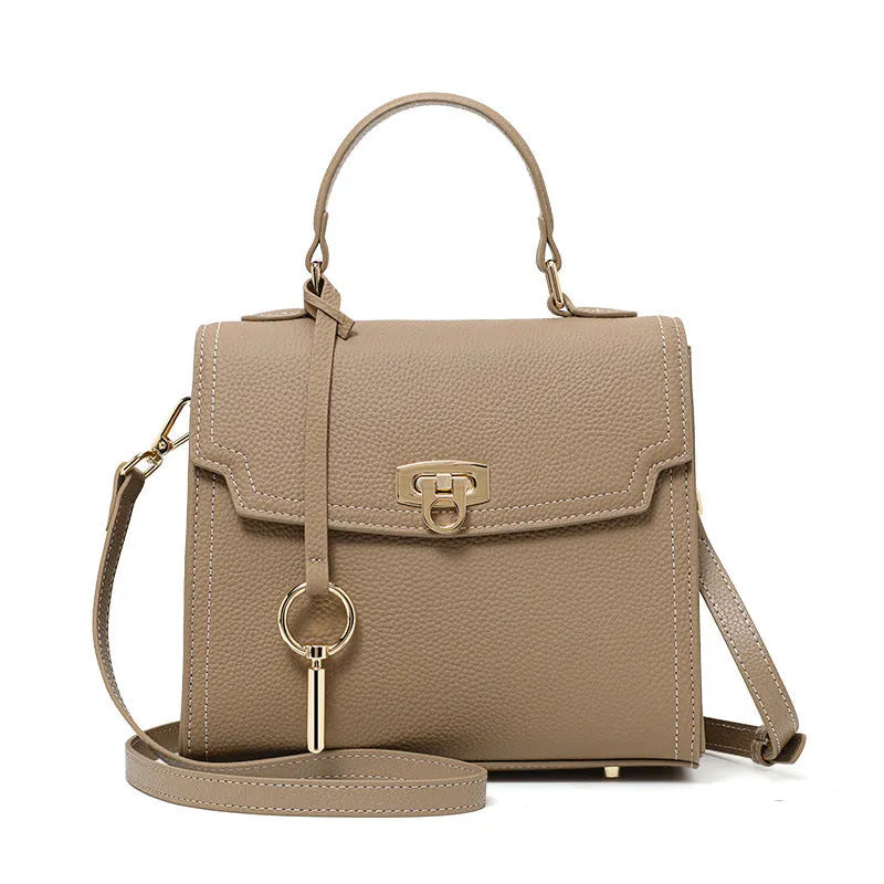 Elephant grey genuine leather handbag with vintage lock and crossbody strap