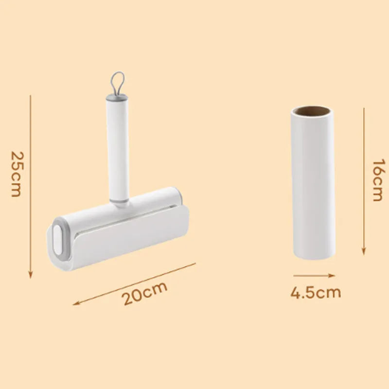 Lint remover roller pet tool with handle and four replacement paper sticks for removing cat hair.