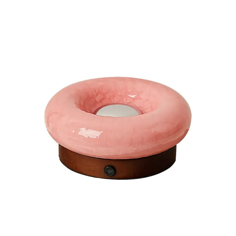 Donut touch table lamp rechargeable with three colour settings, shown in custard, green, orange, or pink.
