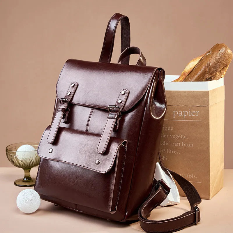 Hard cowhide leather computer backpack in black, brown, or coffee with lining cloth interior