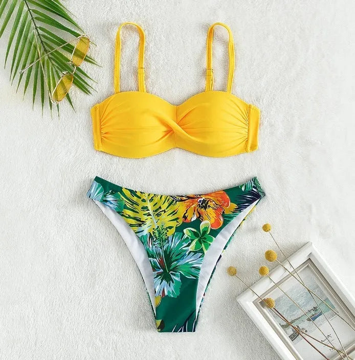 Green hard cup push up bikini swimsuit set with briefs bottom on a mannequin.