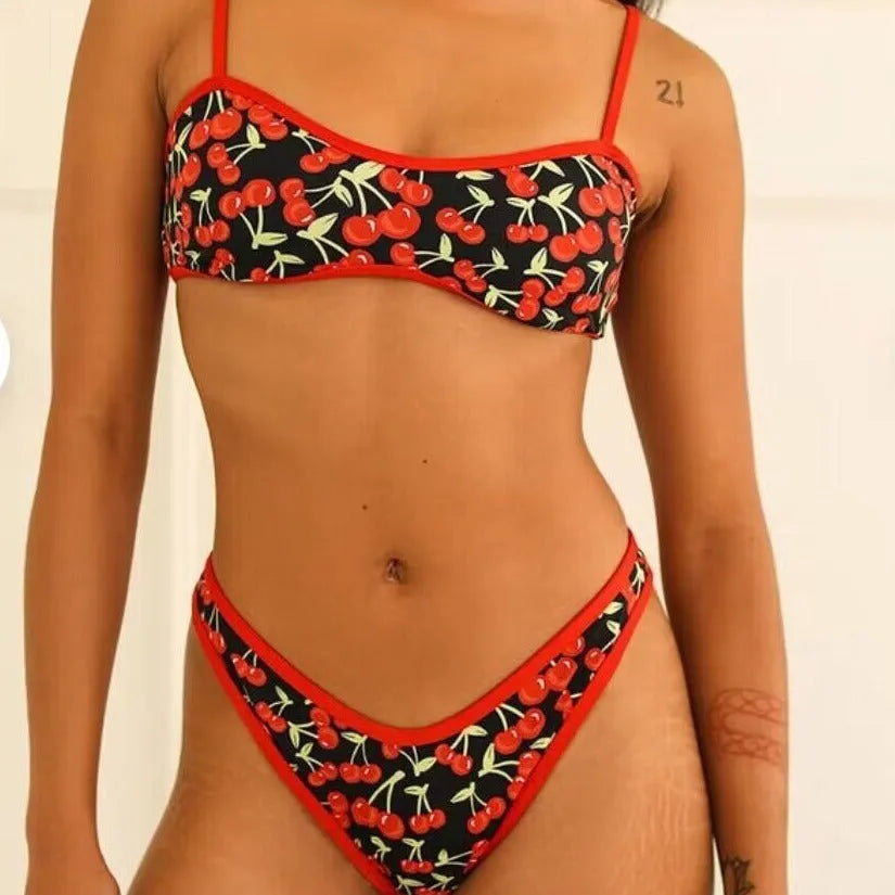 Women's cherry print floral bikini swimsuit with tube top and briefs.