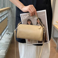 Genuine leather mobile phone crossbody bag with cylindrical design in six colour options showing sewing thread detailing