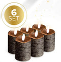 Black S6 LED pillar candle lit, showing flameless light, dimensions 5cm by 7cm.
