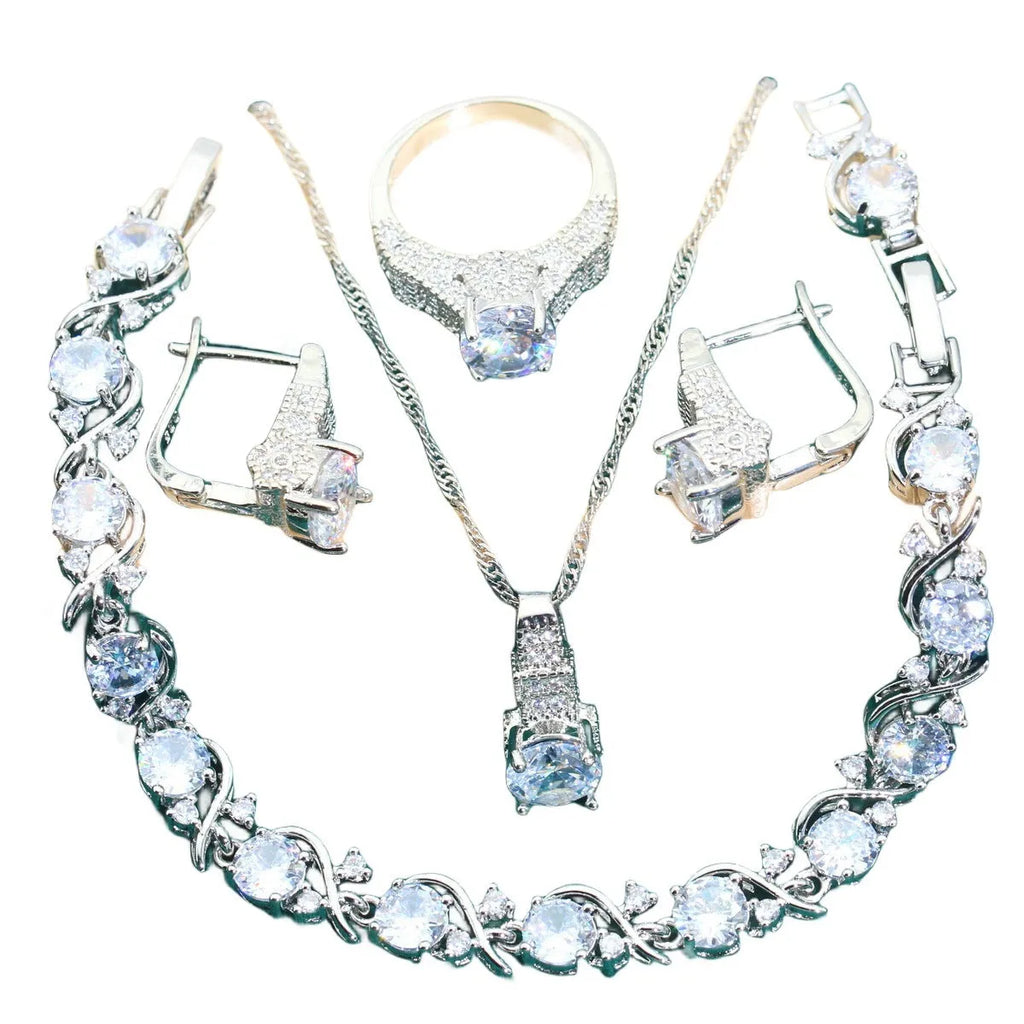 Bridal zircon jewellery four-piece set showing necklace, earrings, bracelet and ring with water wave chain