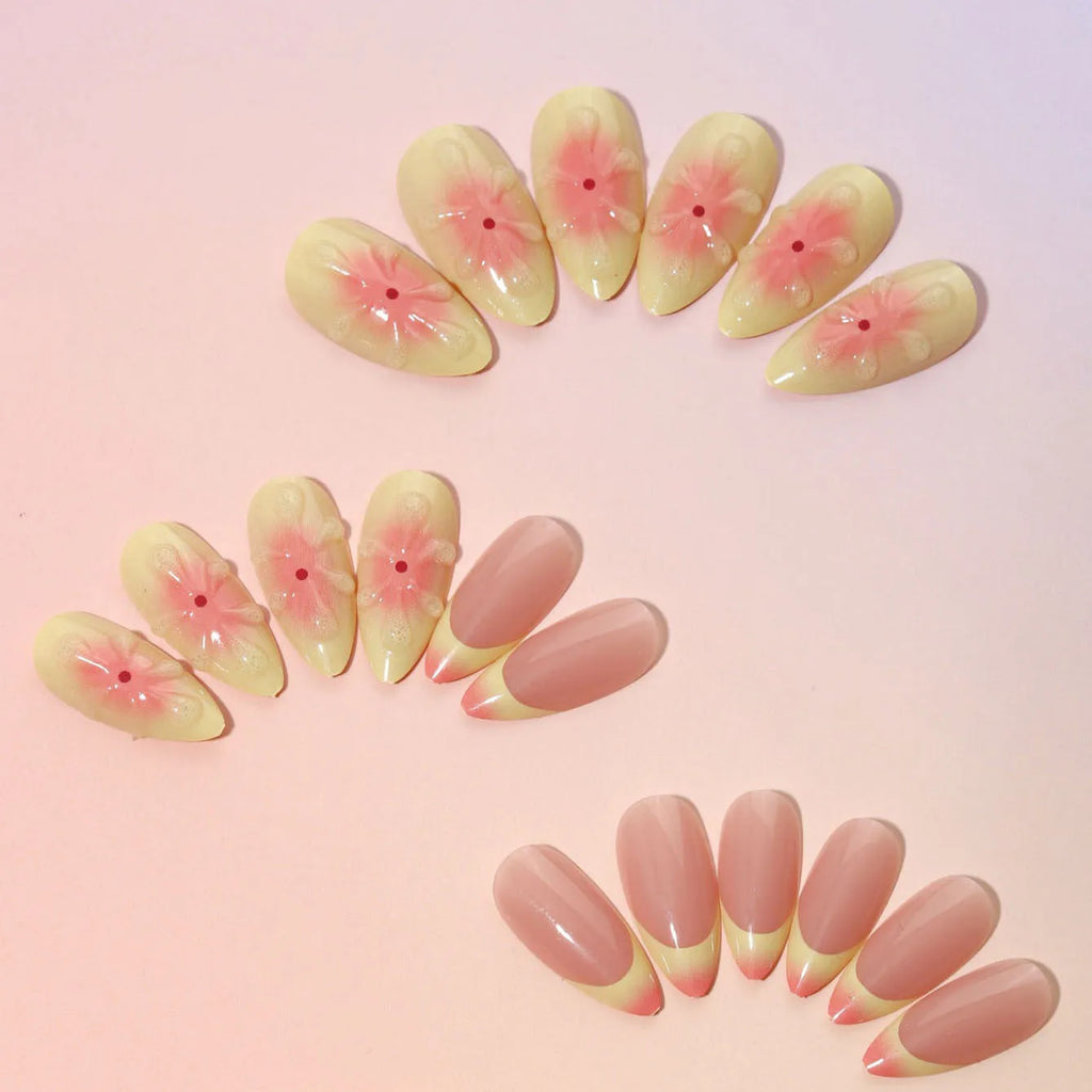 Plastic false nails with 3D cartoon flower design, jelly glue, and a nail file strip on a white background.