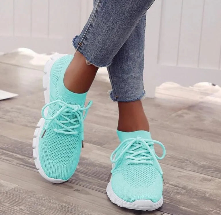 Women's high-cut lace-up casual sneaker in multiple colours on a flat heel with rubber sole