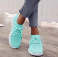 Women's high-cut lace-up casual sneaker in multiple colours on a flat heel with rubber sole