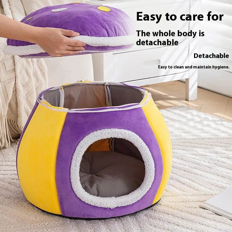 Grey mushroom-shaped plush cat bed with a detachable blanket inside, shown on a wooden floor.