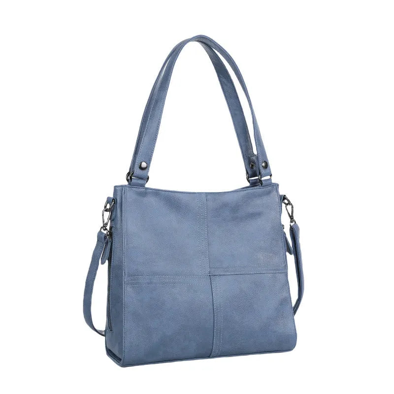 Soft PU leather crossbody handbag with barrel shape and vintage styling in light khaki colour