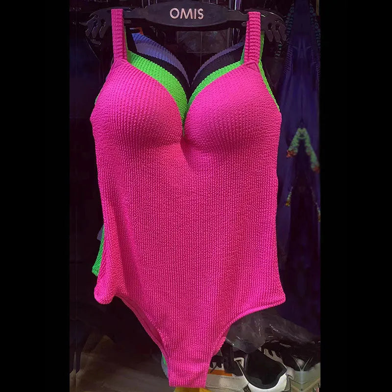 Women's sleeveless one-piece swimsuit with a small sunken stripe pattern in various colours.