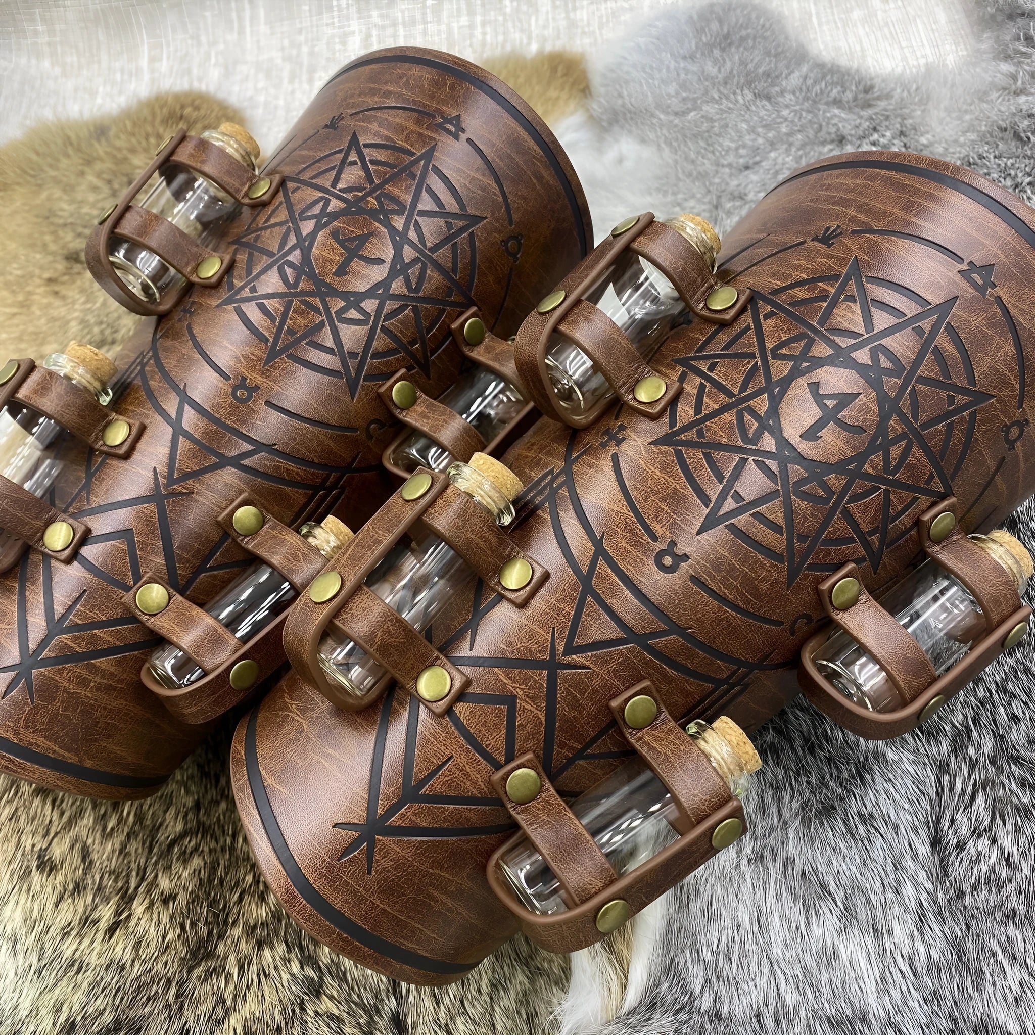 Medieval alchemy bottle wristband in black PU leather on wrist against dark background