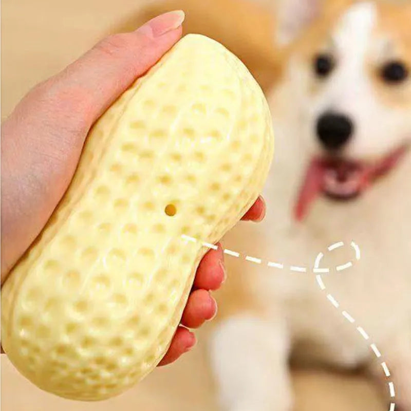 Yellow squeaky peanut-shaped dog chew toy made of durable TPR rubber.