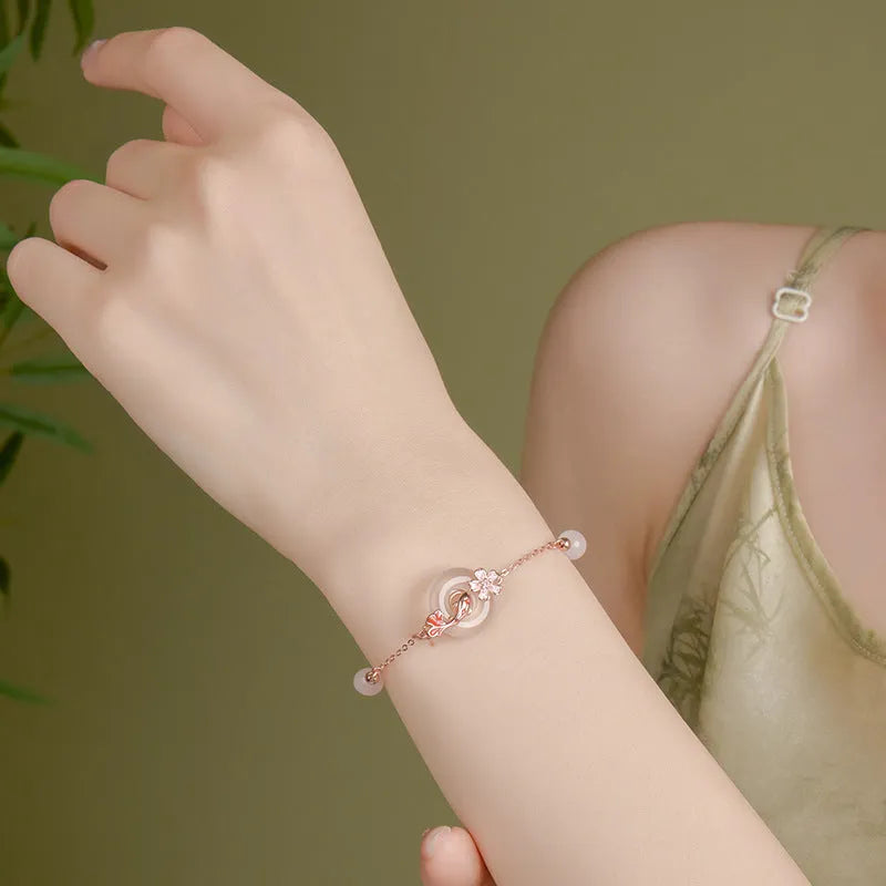 Sterling silver bracelet with white chalcedony crystals and electroplated koi pattern design
