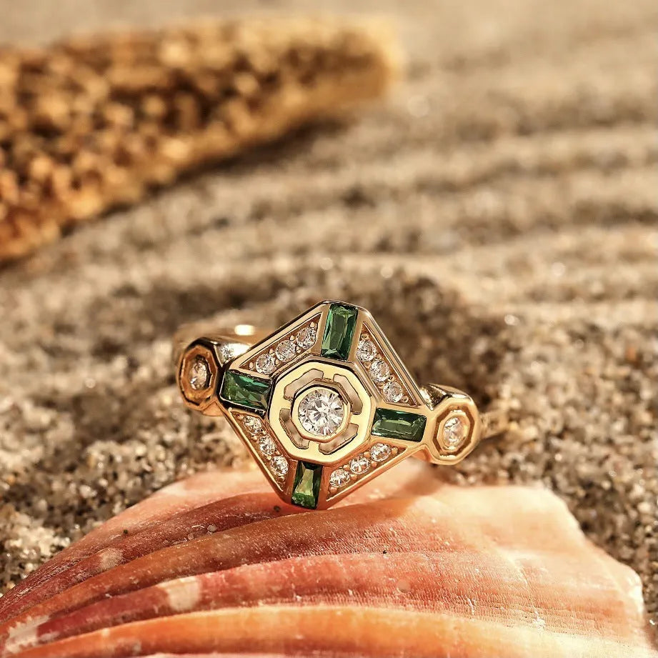 Ins style square emerald diamond ring in lvzuan colour on a white background.
