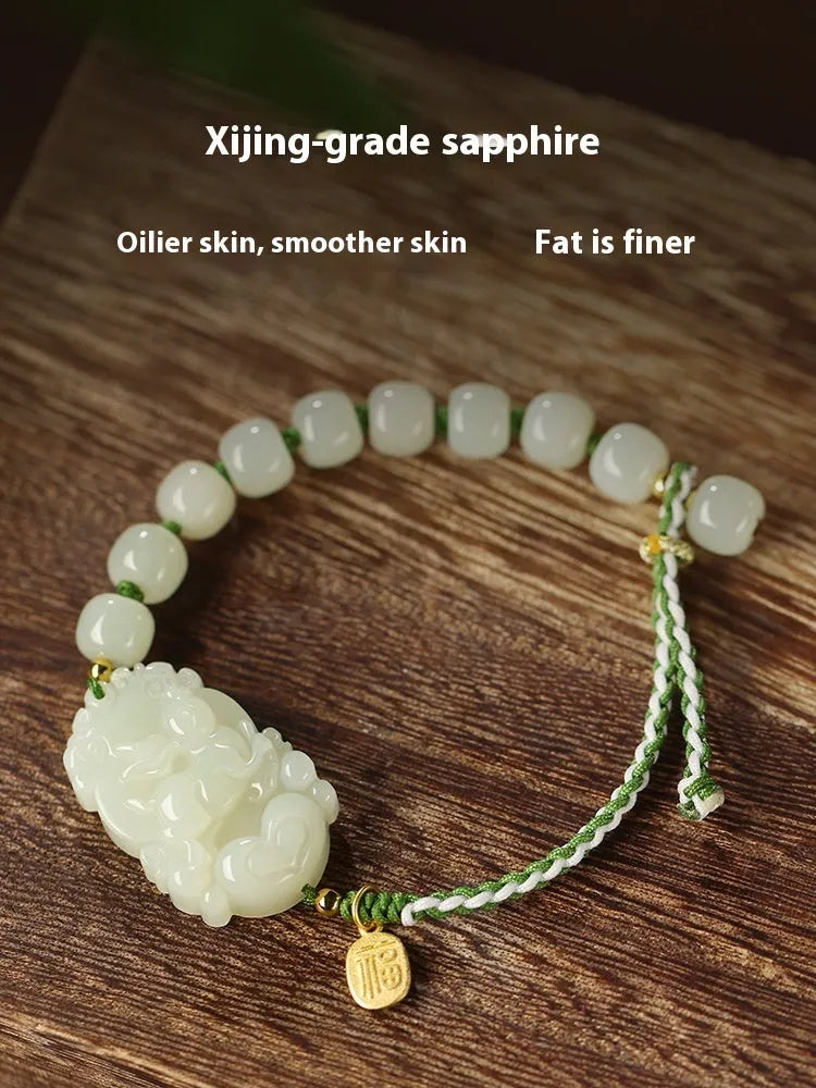 Hetian jade and S925 silver Chinese zodiac bracelet on a red rope for the Year of the Rabbit